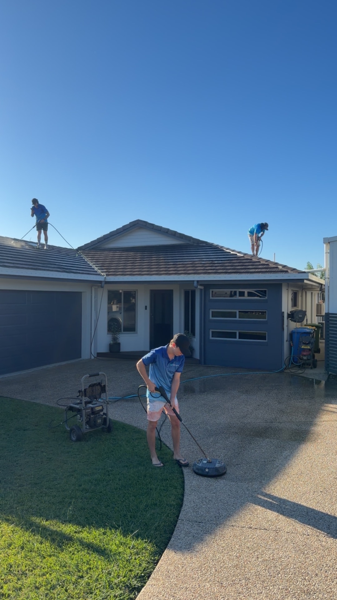Driveway and roof being pressure cleaned at a Mackay home