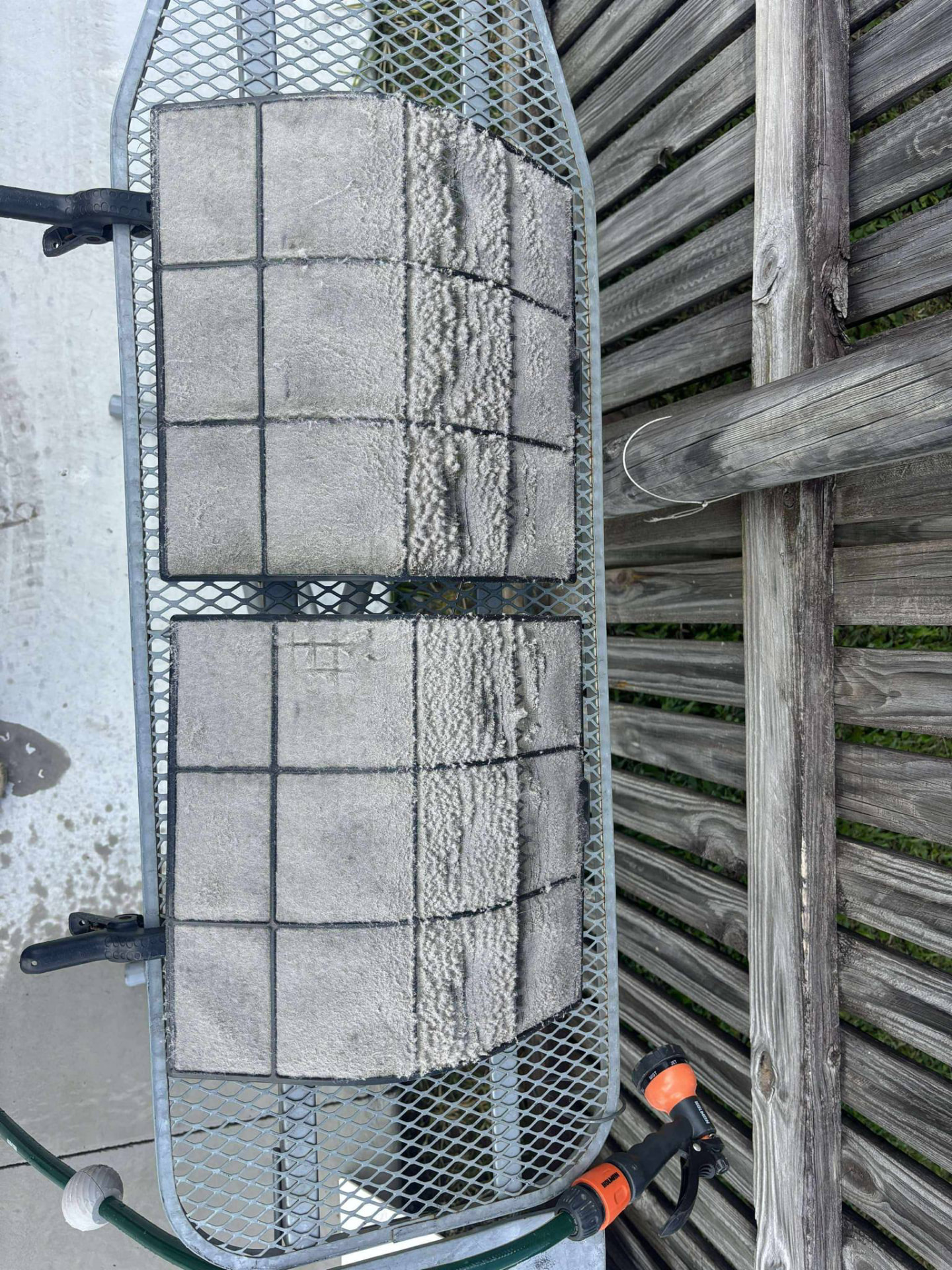 Air conditioner filters thick with dust and lint before cleaning